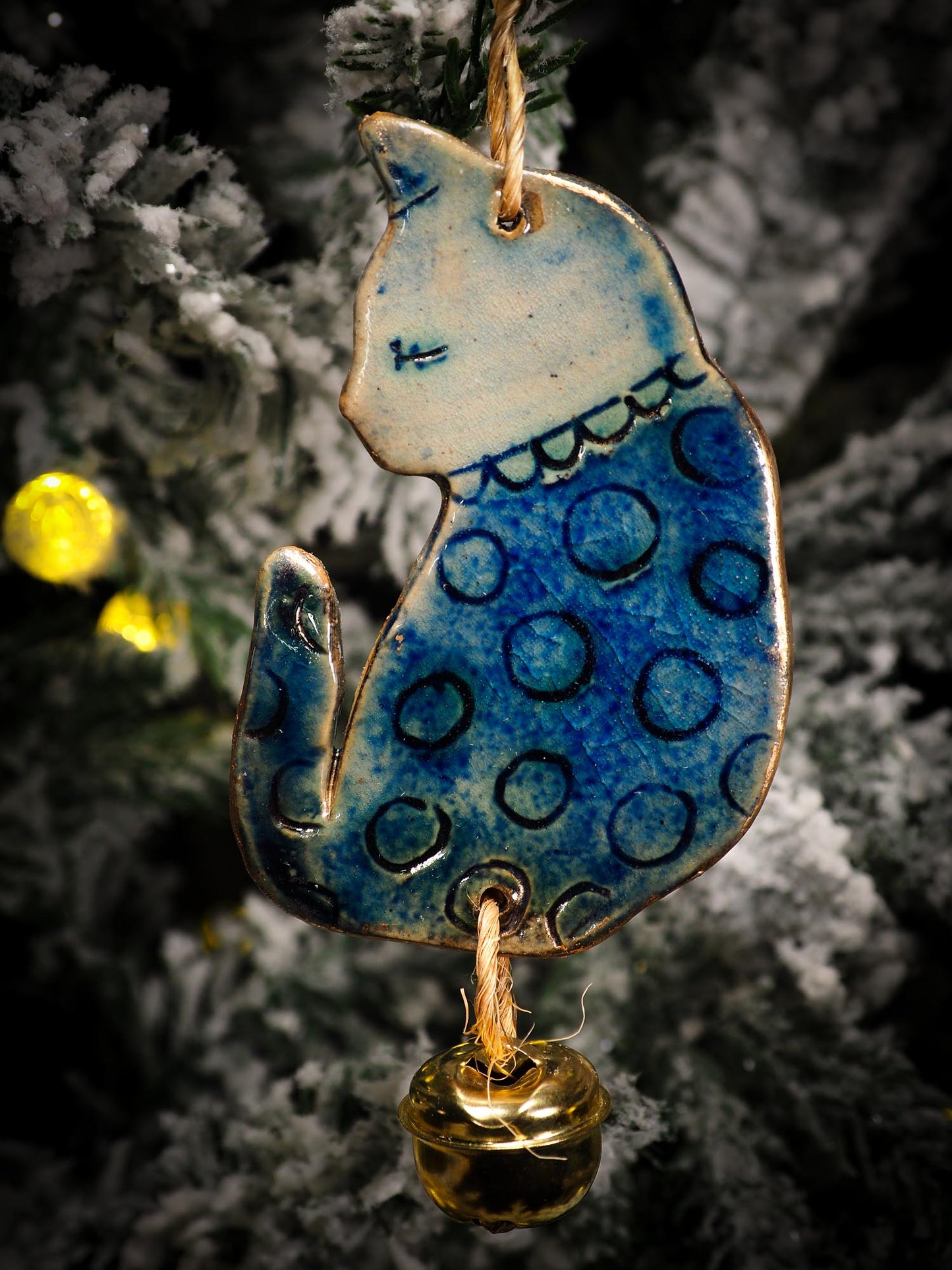 An original Christmas Holiday tree round glazed ceramic ornament handmade by Idania Salcido, the artist behind Danita Art. Glazed carved sgraffito stoneware, hand painted and decorated, it is illustrated by hand with snowmen, Christmas trees, Santa Claus, angels and snow balls and winter themes.