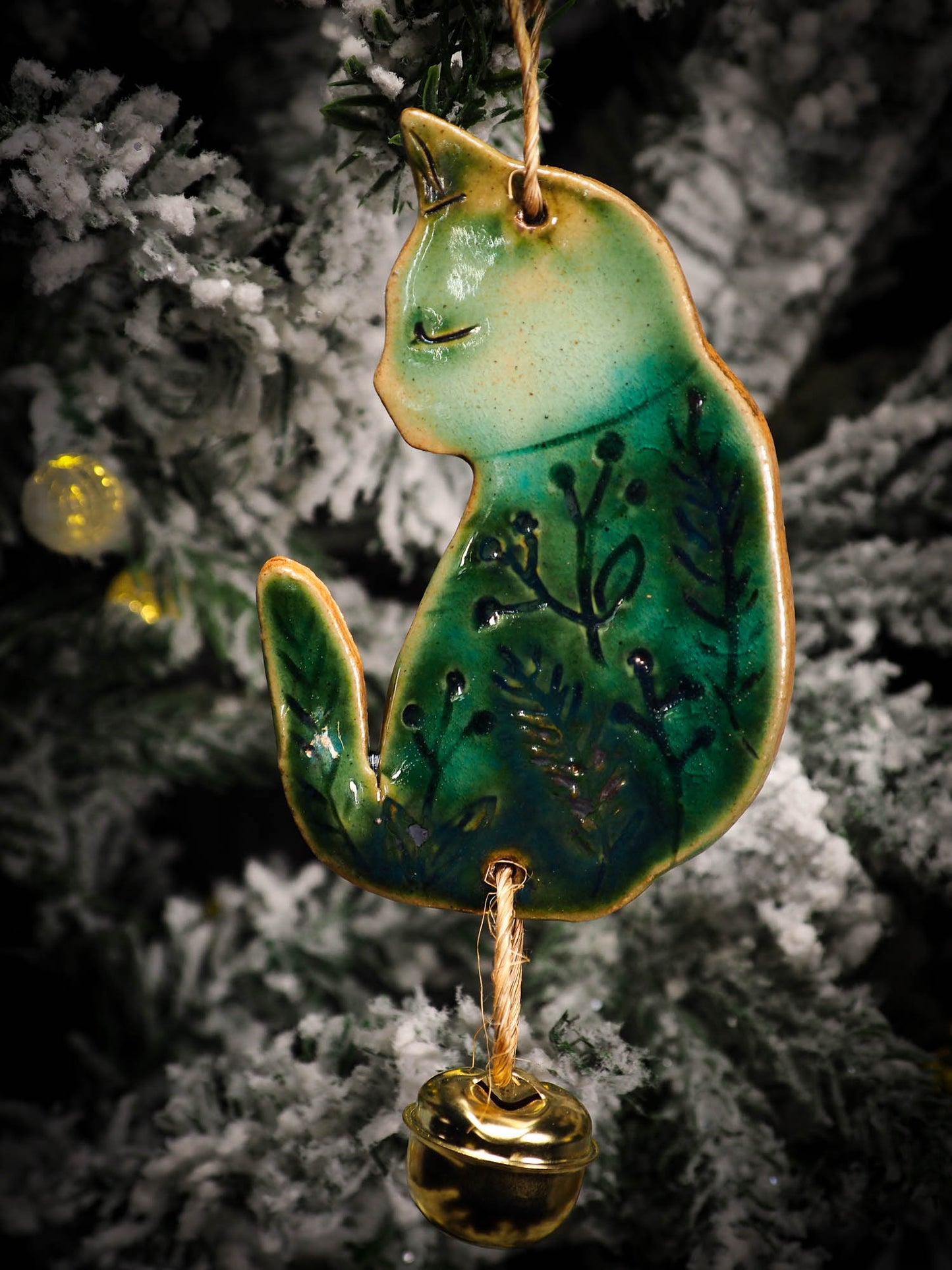 An original Christmas Holiday tree round glazed ceramic ornament handmade by Idania Salcido, the artist behind Danita Art. Glazed carved sgraffito stoneware, hand painted and decorated, it is illustrated by hand with snowmen, Christmas trees, Santa Claus, angels and snow balls and winter themes.