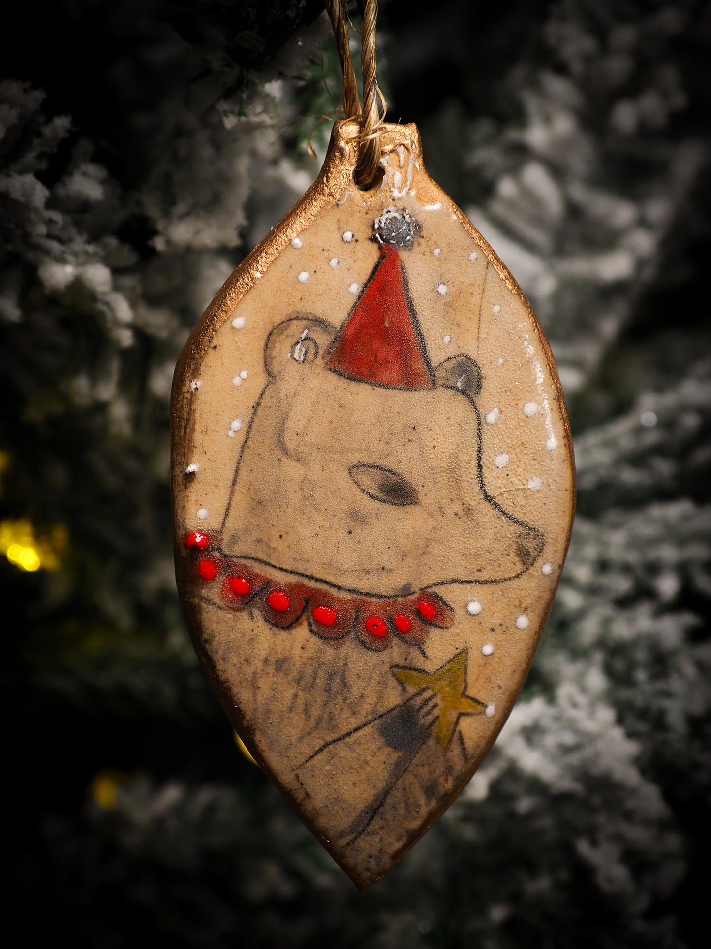 An original Christmas Holiday tree round glazed ceramic ornament handmade by Idania Salcido, the artist behind Danita Art. Glazed carved sgraffito stoneware, hand painted and decorated, it is illustrated by hand with snowmen, Christmas trees, Santa Claus, angels and snow balls and winter themes.