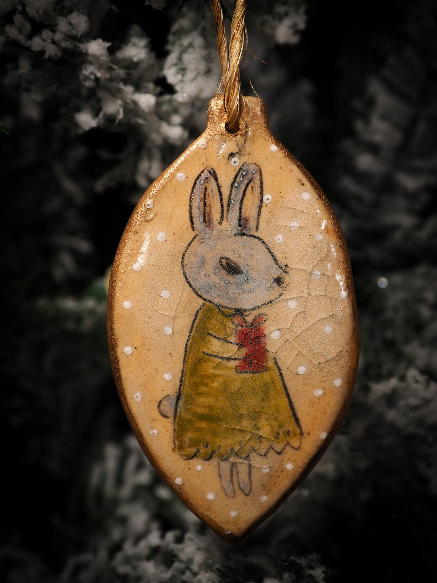 An original Christmas Holiday tree round glazed ceramic ornament handmade by Idania Salcido, the artist behind Danita Art. Glazed carved sgraffito stoneware, hand painted and decorated, it is illustrated by hand with snowmen, Christmas trees, Santa Claus, angels and snow balls and winter themes.