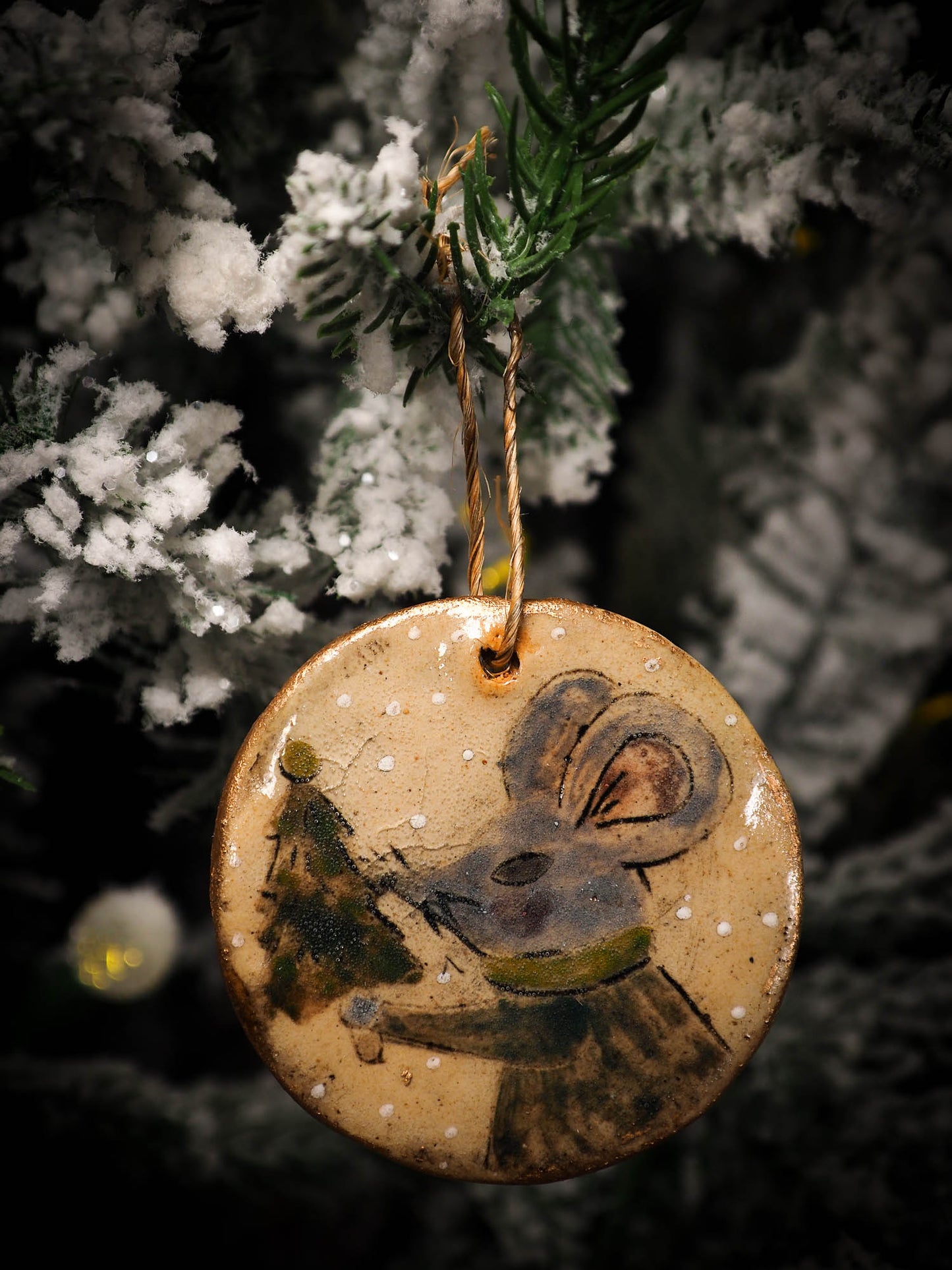 An original Christmas Holiday tree round glazed ceramic ornament handmade by Idania Salcido, the artist behind Danita Art. Glazed carved sgraffito stoneware, hand painted and decorated, it is illustrated by hand with snowmen, Christmas trees, Santa Claus, angels and snow balls and winter themes.