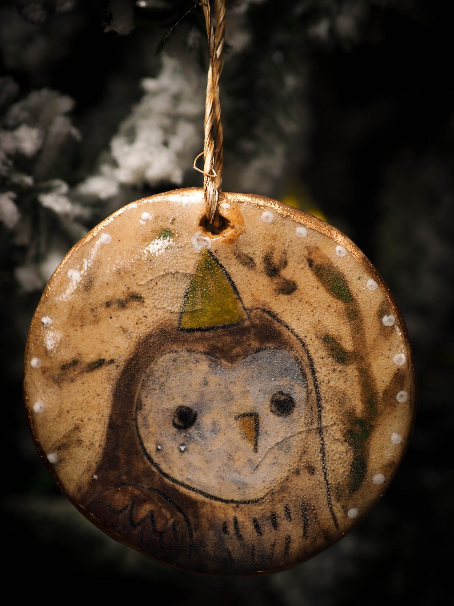 An original Christmas Holiday tree round glazed ceramic ornament handmade by Idania Salcido, the artist behind Danita Art. Glazed carved sgraffito stoneware, hand painted and decorated, it is illustrated by hand with snowmen, Christmas trees, Santa Claus, angels and snow balls and winter themes.