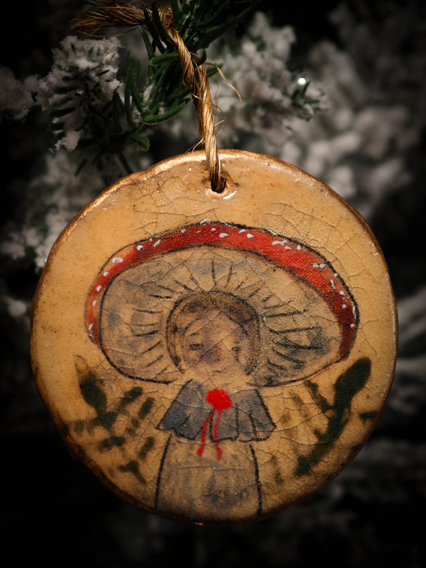 An original Christmas Holiday tree round glazed ceramic ornament handmade by Idania Salcido, the artist behind Danita Art. Glazed carved sgraffito stoneware, hand painted and decorated, it is illustrated by hand with snowmen, Christmas trees, Santa Claus, angels and snow balls and winter themes.