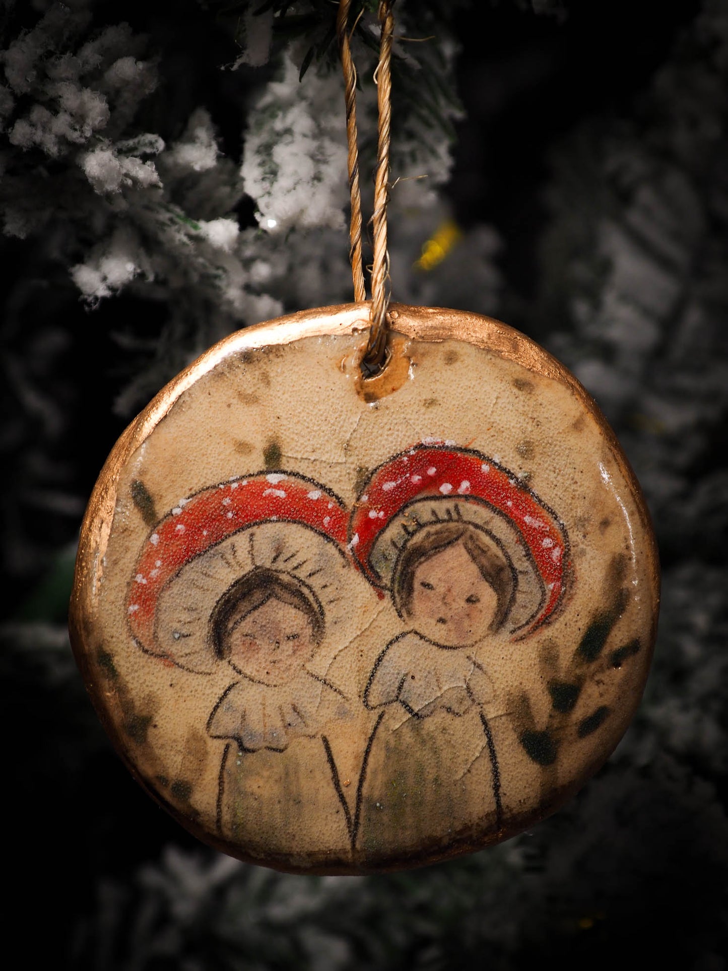 An original Christmas Holiday tree round glazed ceramic ornament handmade by Idania Salcido, the artist behind Danita Art. Glazed carved sgraffito stoneware, hand painted and decorated, it is illustrated by hand with snowmen, Christmas trees, Santa Claus, angels and snow balls and winter themes.