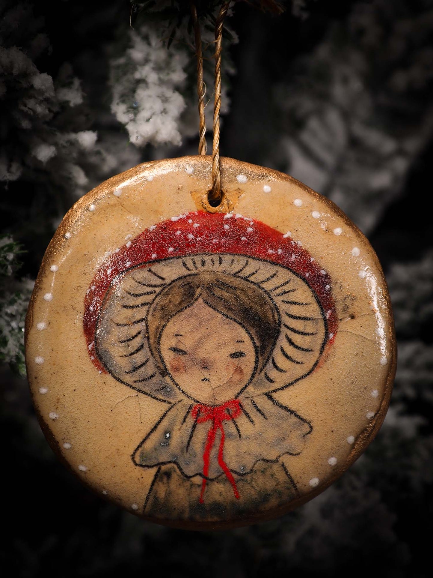 An original Christmas Holiday tree round glazed ceramic ornament handmade by Idania Salcido, the artist behind Danita Art. Glazed carved sgraffito stoneware, hand painted and decorated, it is illustrated by hand with snowmen, Christmas trees, Santa Claus, angels and snow balls and winter themes.