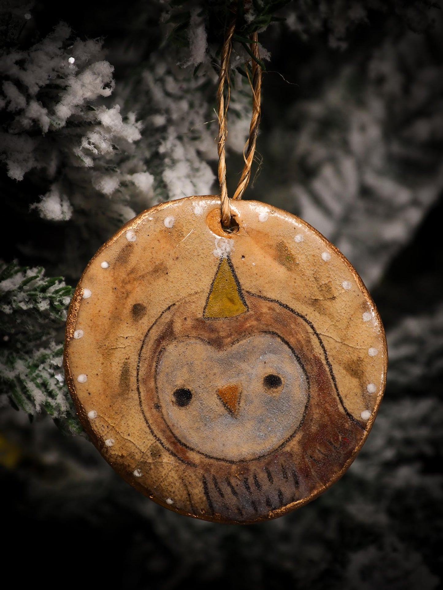 An original Christmas Holiday tree round glazed ceramic ornament handmade by Idania Salcido, the artist behind Danita Art. Glazed carved sgraffito stoneware, hand painted and decorated, it is illustrated by hand with snowmen, Christmas trees, Santa Claus, angels and snow balls and winter themes.