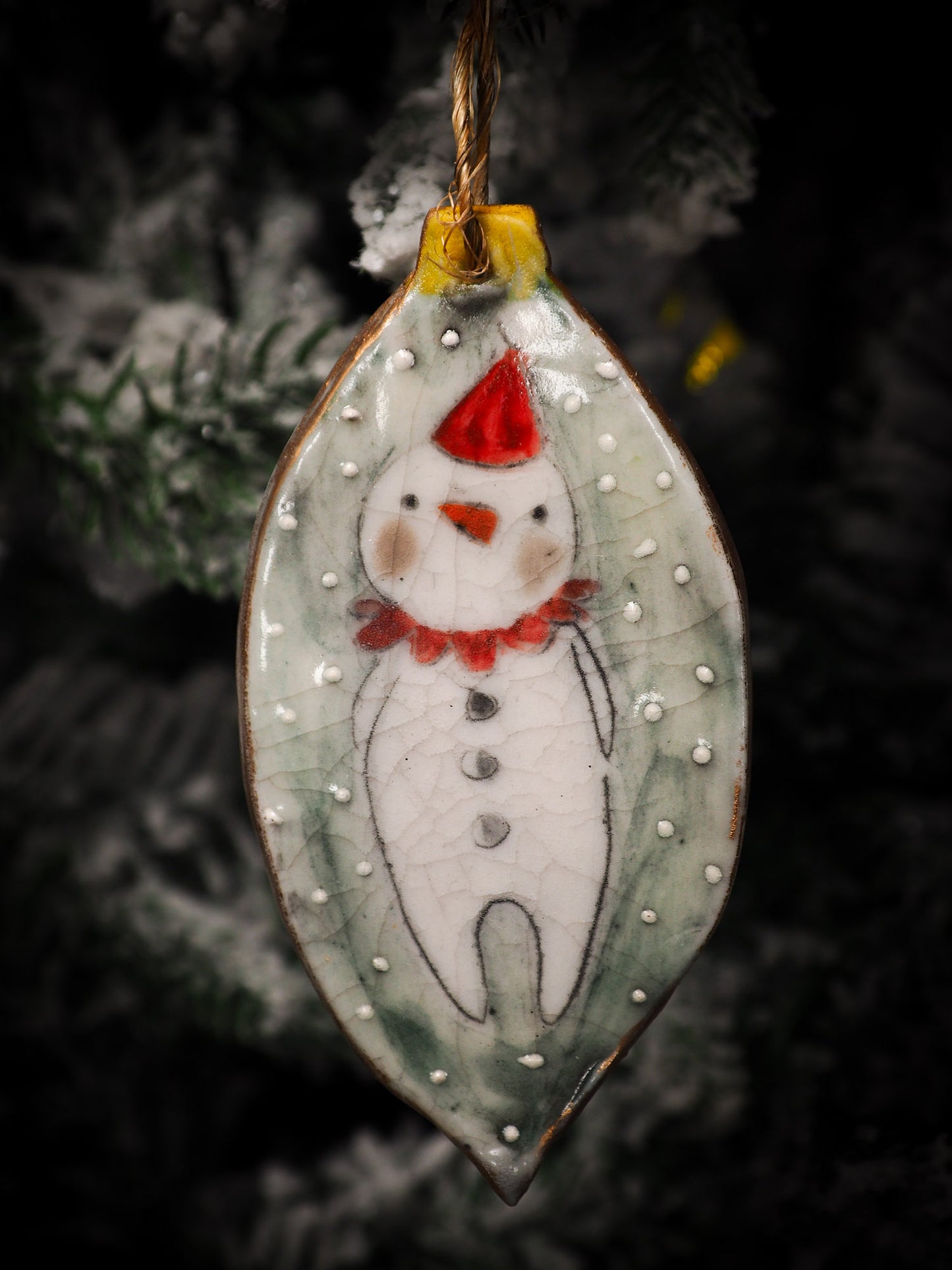 An original Christmas Holiday tree round glazed ceramic ornament handmade by Idania Salcido, the artist behind Danita Art. Glazed carved sgraffito stoneware, hand painted and decorated, it is illustrated by hand with snowmen, Christmas trees, Santa Claus, angels and snow balls and winter themes.