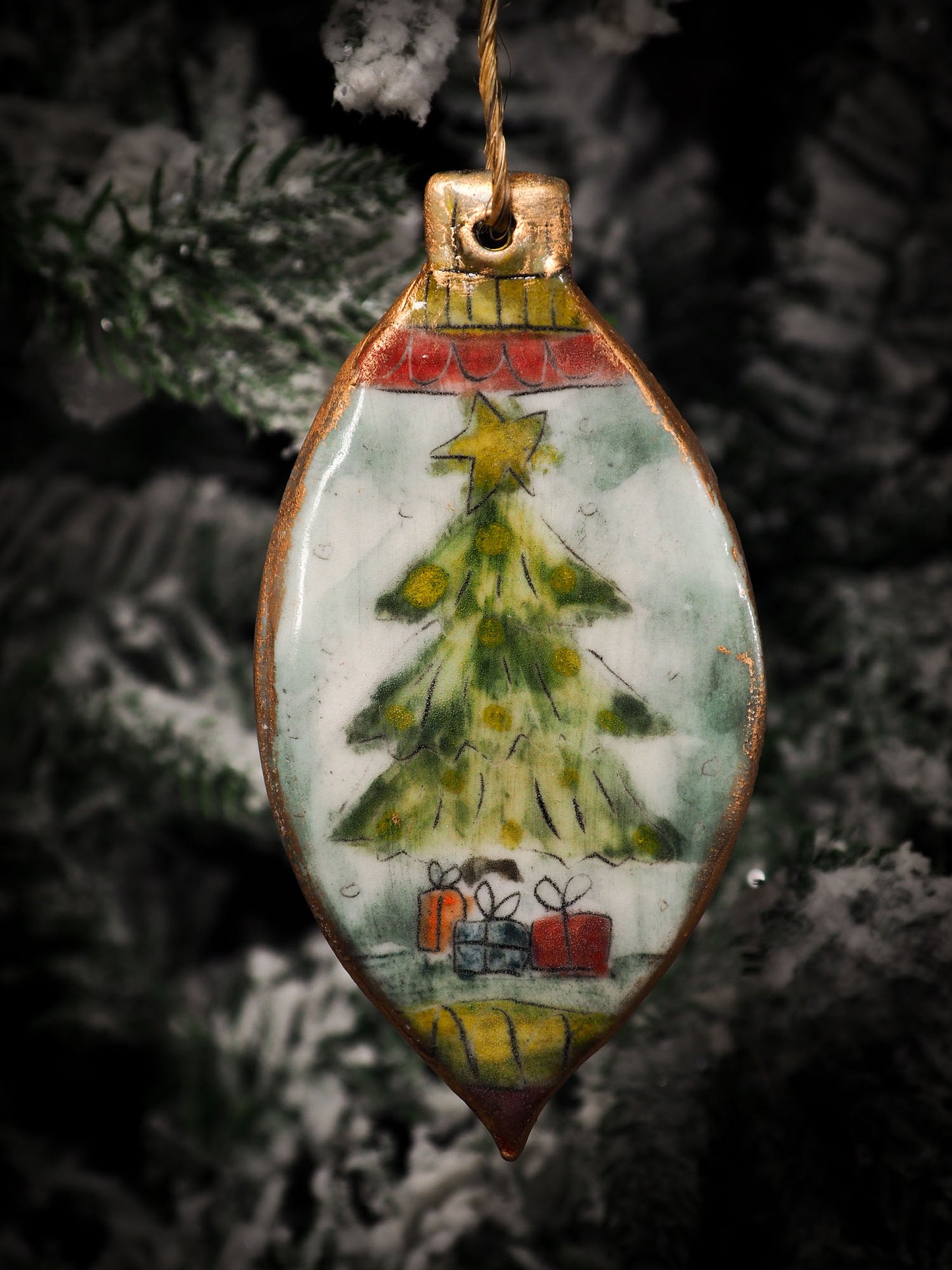 An original Christmas Holiday tree round glazed ceramic ornament handmade by Idania Salcido, the artist behind Danita Art. Glazed carved sgraffito stoneware, hand painted and decorated, it is illustrated by hand with snowmen, Christmas trees, Santa Claus, angels and snow balls and winter themes.