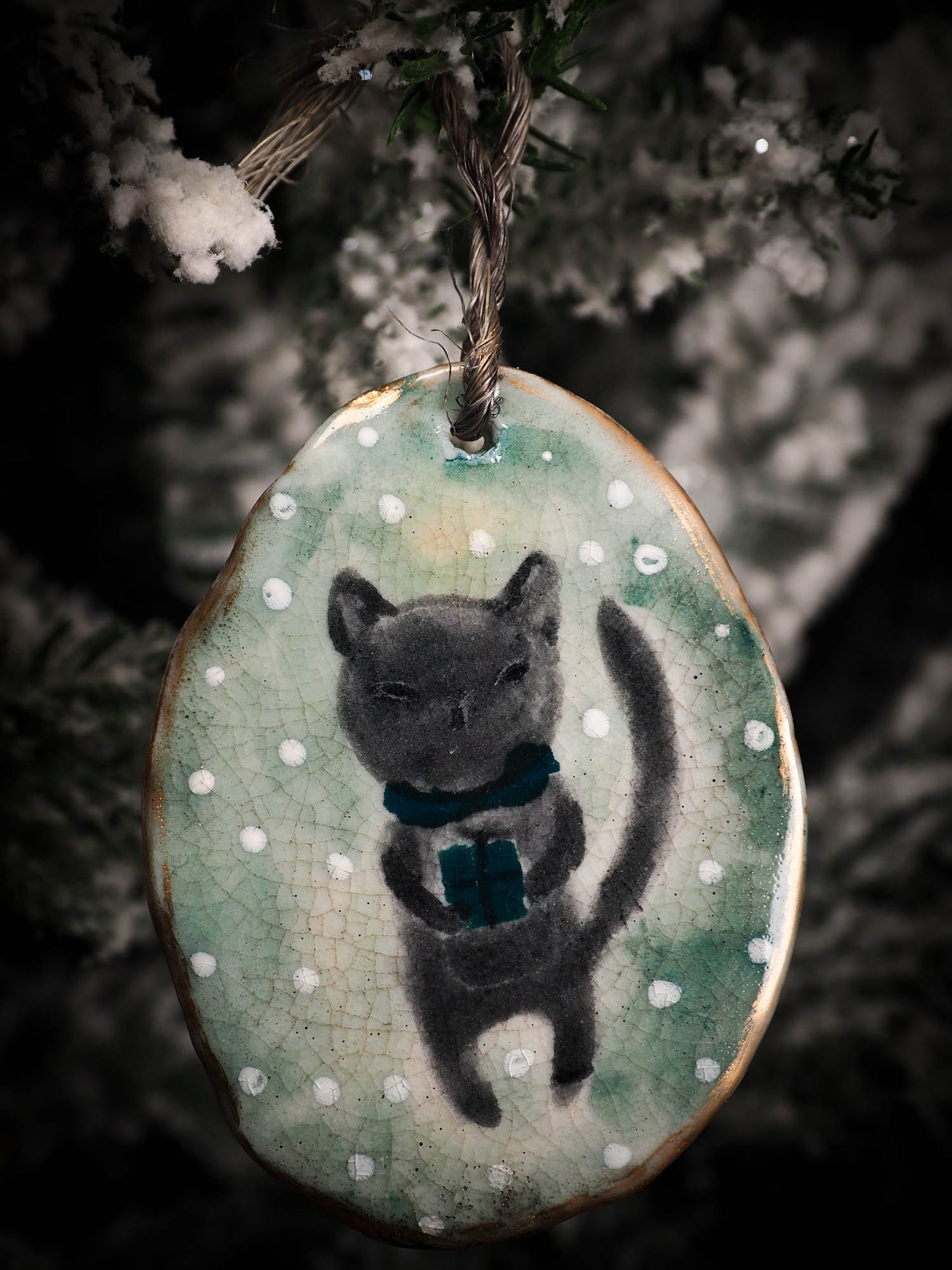 An original Christmas Holiday tree round glazed ceramic ornament handmade by Idania Salcido, the artist behind Danita Art. Glazed carved sgraffito stoneware, hand painted and decorated, it is illustrated by hand with snowmen, Christmas trees, Santa Claus, angels and snow balls and winter themes.