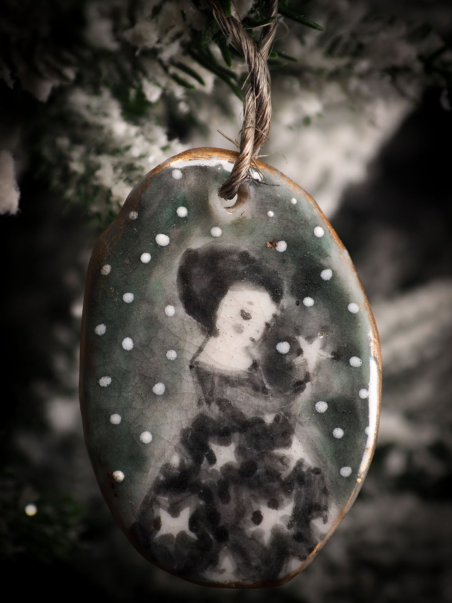 An original Christmas Holiday tree round glazed ceramic ornament handmade by Idania Salcido, the artist behind Danita Art. Glazed carved sgraffito stoneware, hand painted and decorated, it is illustrated by hand with snowmen, Christmas trees, Santa Claus, angels and snow balls and winter themes.