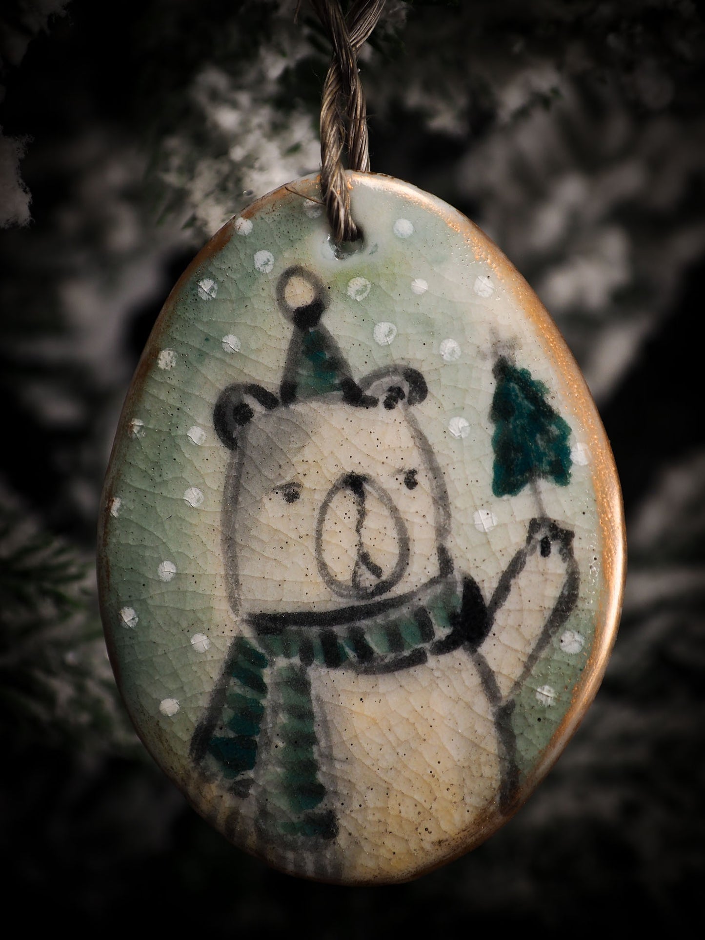 An original Christmas Holiday tree round glazed ceramic ornament handmade by Idania Salcido, the artist behind Danita Art. Glazed carved sgraffito stoneware, hand painted and decorated, it is illustrated by hand with snowmen, Christmas trees, Santa Claus, angels and snow balls and winter themes.