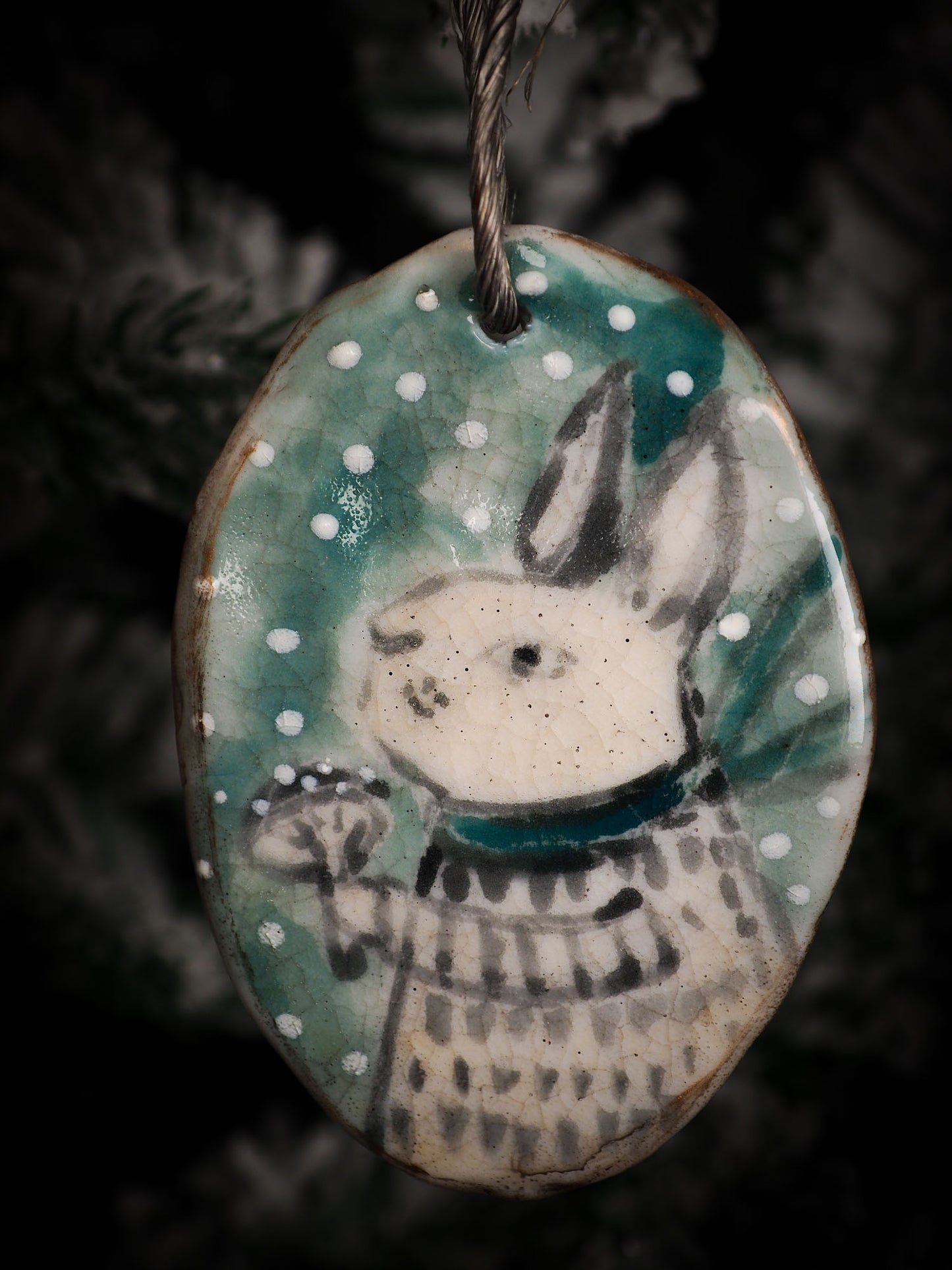 An original Christmas Holiday tree round glazed ceramic ornament handmade by Idania Salcido, the artist behind Danita Art. Glazed carved sgraffito stoneware, hand painted and decorated, it is illustrated by hand with snowmen, Christmas trees, Santa Claus, angels and snow balls and winter themes.