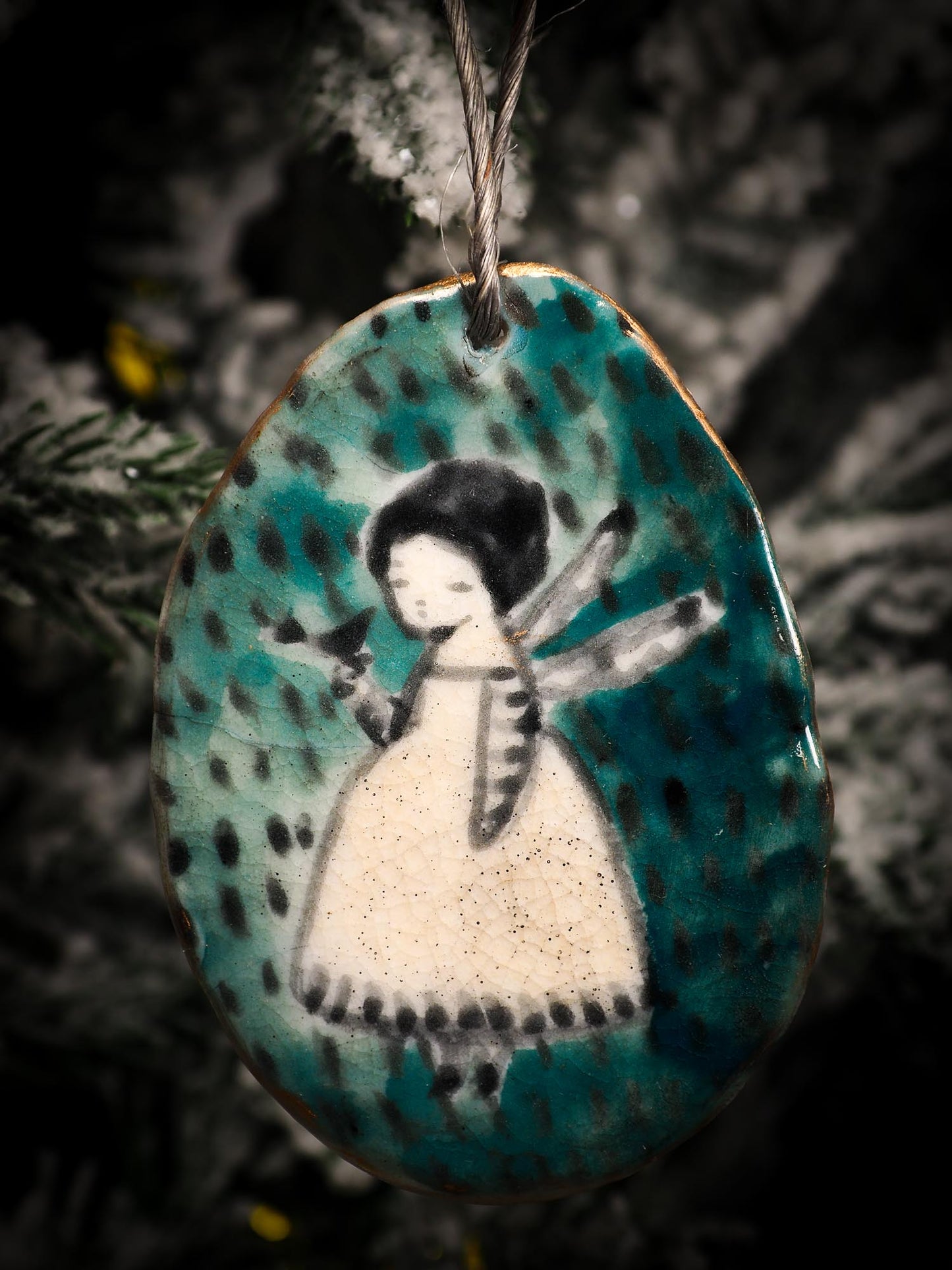 An original Christmas Holiday tree round glazed ceramic ornament handmade by Idania Salcido, the artist behind Danita Art. Glazed carved sgraffito stoneware, hand painted and decorated, it is illustrated by hand with snowmen, Christmas trees, Santa Claus, angels and snow balls and winter themes.