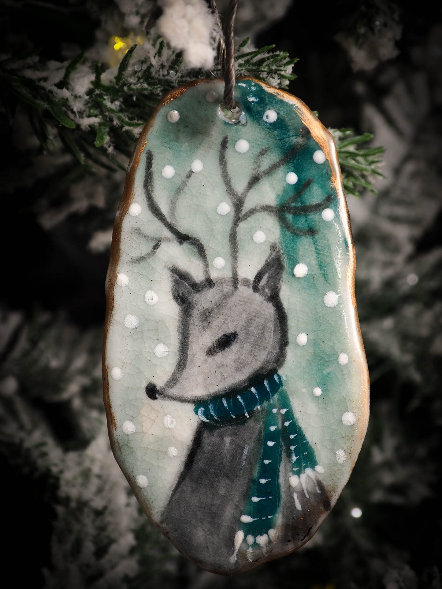 An original Christmas Holiday tree round glazed ceramic ornament handmade by Idania Salcido, the artist behind Danita Art. Glazed carved sgraffito stoneware, hand painted and decorated, it is illustrated by hand with snowmen, Christmas trees, Santa Claus, angels and snow balls and winter themes.