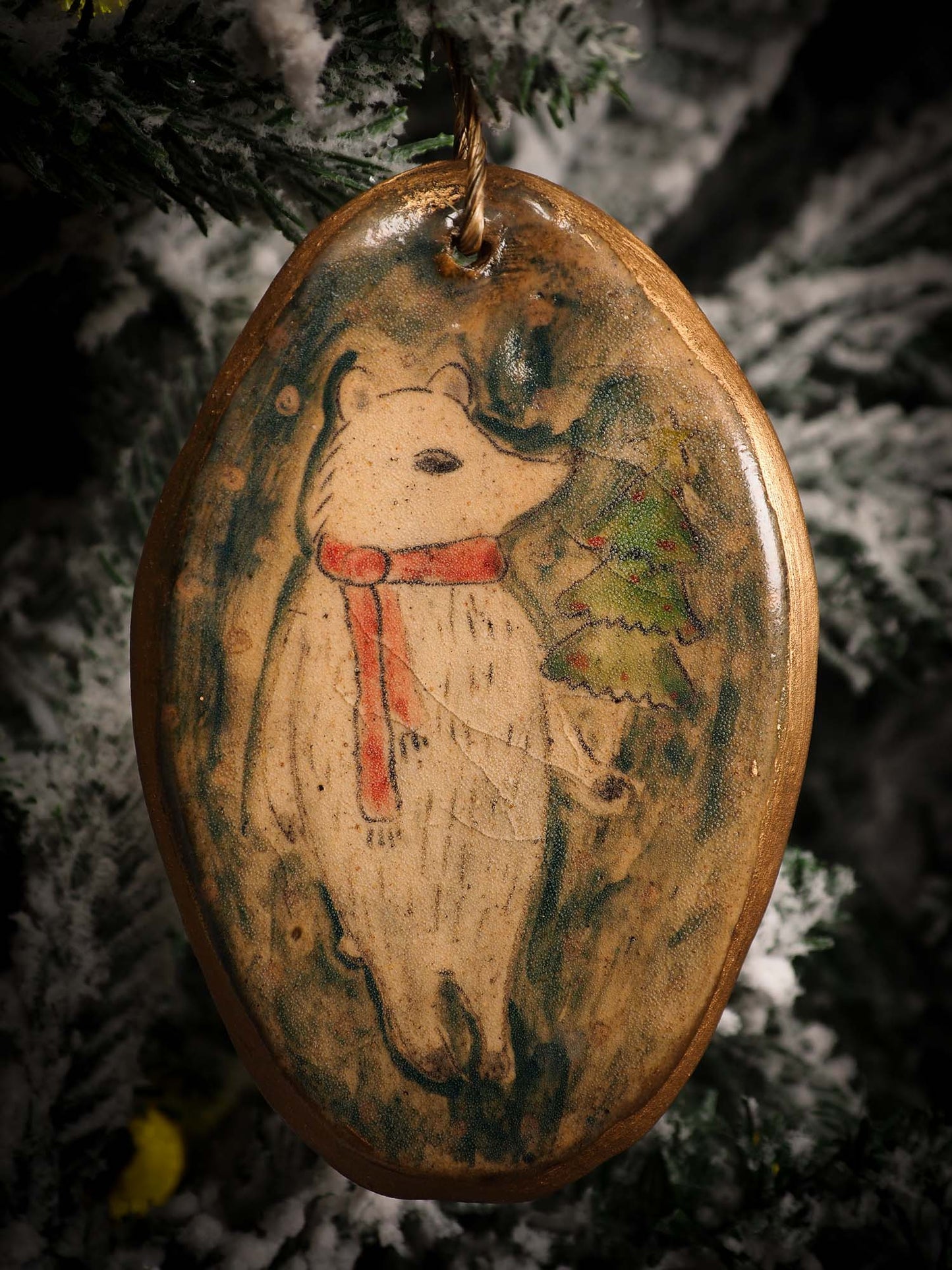 An original Christmas Holiday tree round glazed ceramic ornament handmade by Idania Salcido, the artist behind Danita Art. Glazed carved sgraffito stoneware, hand painted and decorated, it is illustrated by hand with snowmen, Christmas trees, Santa Claus, angels and snow balls and winter themes.