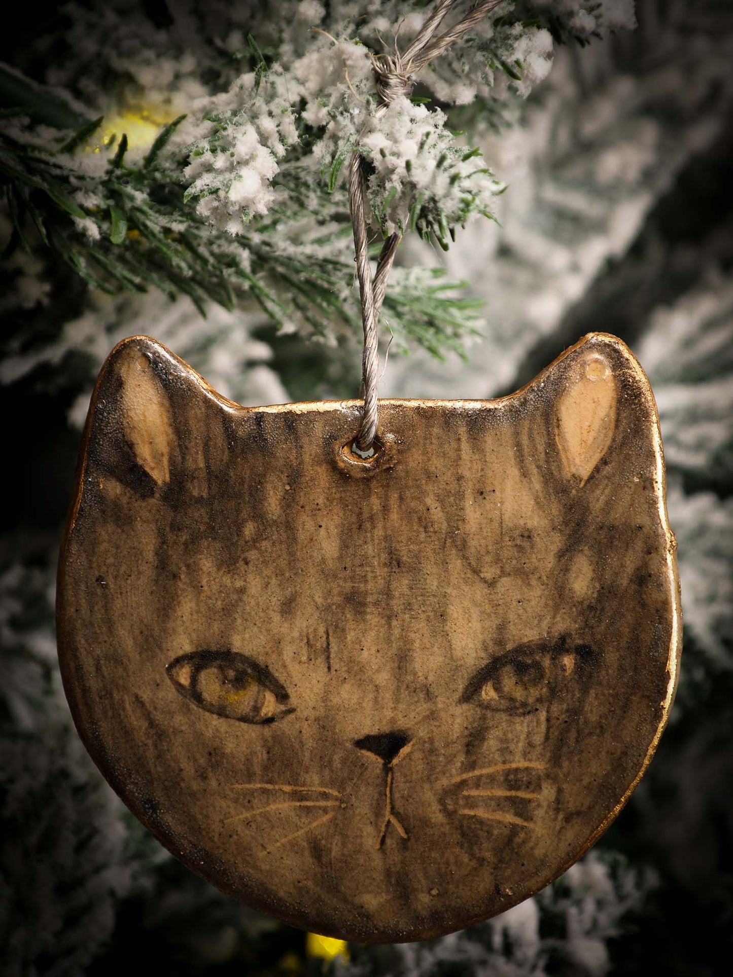 An original Christmas Holiday tree round glazed ceramic ornament handmade by Idania Salcido, the artist behind Danita Art. Glazed carved sgraffito stoneware, hand painted and decorated, it is illustrated by hand with snowmen, Christmas trees, Santa Claus, angels and snow balls and winter themes.