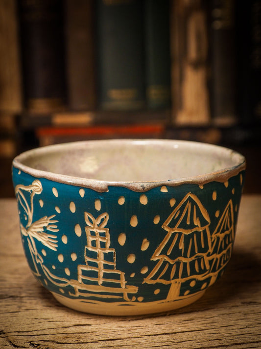 An original Christmas fire glazed ceramic handmade piece by Idania Salcido, the artist behind Danita Art. Glazed, carved sgraffito stoneware, hand painted and decorated, it is illustrated by hand with snowmen, Christmas trees, Santa Claus, angels and snow balls and winter themes.