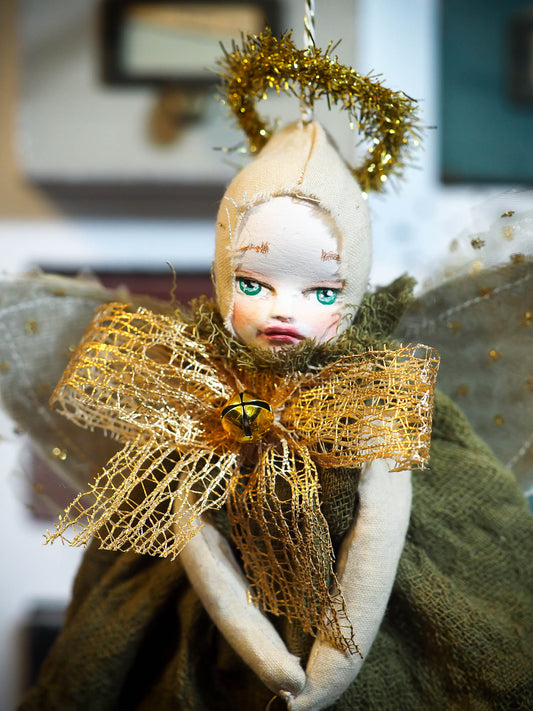 ou are looking at an original handmade Christmas tree ornament by Danita Art. This beautiful holiday angel is completely hand crafted by Danita in her studio, using sculpted faces she paints by hand, giving each doll a unique personality. The dress in this doll is hand dyed using natural pigments that Danita extracts from flowers, fruits and seeds, and they have a very organic and natural aged and distressed look.