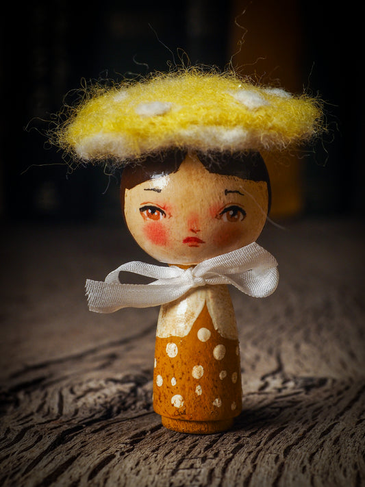 A beautiful collection of Mushroom dolls by Idania Salcido, the artist behind Danita Art. Each little wooden kokeshi doll is hand made by Danita Art with hand painted wood body, expressive and unique faces with a unique personality. Topped by a mushroom felted organic wool cap for a woodland feel to them.