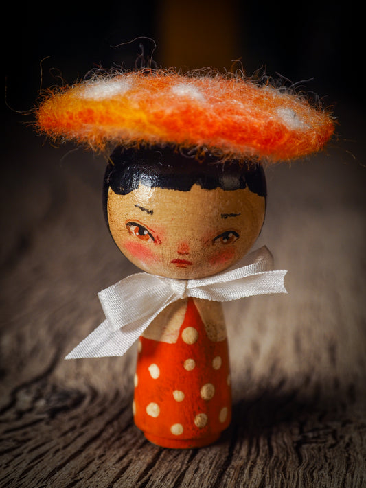 A beautiful collection of Mushroom dolls by Idania Salcido, the artist behind Danita Art. Each little wooden kokeshi doll is hand made by Danita Art with hand painted wood body, expressive and unique faces with a unique personality. Topped by a mushroom felted organic wool cap for a woodland feel to them.