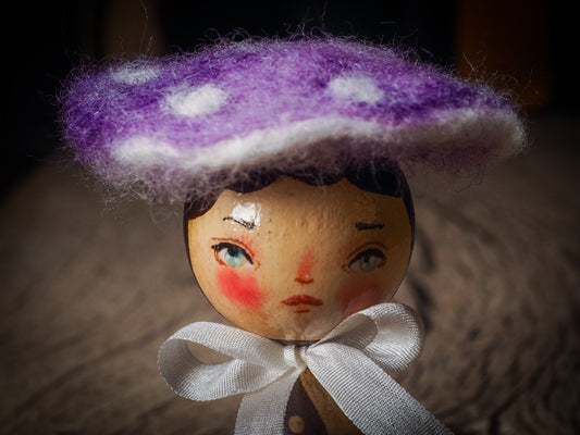 A beautiful collection of Mushroom dolls by Idania Salcido, the artist behind Danita Art. Each little wooden kokeshi doll is hand made by Danita Art with hand painted wood body, expressive and unique faces with a unique personality. Topped by a mushroom felted organic wool cap for a woodland feel to them.