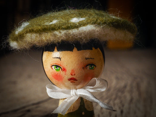 A beautiful collection of Mushroom dolls by Idania Salcido, the artist behind Danita Art. Each little wooden kokeshi doll is hand made by Danita Art with hand painted wood body, expressive and unique faces with a unique personality. Topped by a mushroom felted organic wool cap for a woodland feel to them.