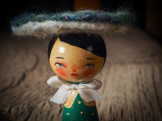 A beautiful collection of Mushroom dolls by Idania Salcido, the artist behind Danita Art. Each little wooden kokeshi doll is hand made by Danita Art with hand painted wood body, expressive and unique faces with a unique personality. Topped by a mushroom felted organic wool cap for a woodland feel to them.