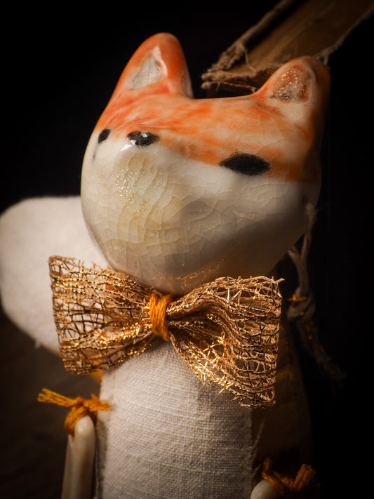 An adorable hand made porcelain and fabric fine art doll by Idania Salcido Danita Art. Perfect to hang as a delicate Christmas tree ornament, this fired ceramic mixed media artwork is unique. Each doll has a beautiful hand sculpted porcelain ceramic face and hand dyed fabric body with vintage accessories as home decor.