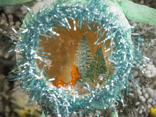 Adorable handmade spun cotton Art Doll Christmas tree ornament by Idania Salcido, the artist by Danita Art. Hand painted by the artist holiday figurine with paper hat with tinsel and vintage style garlands and a tiny Christmas tree. Hang this handmade ornament from your Christmas tree or use as Holiday decoration.