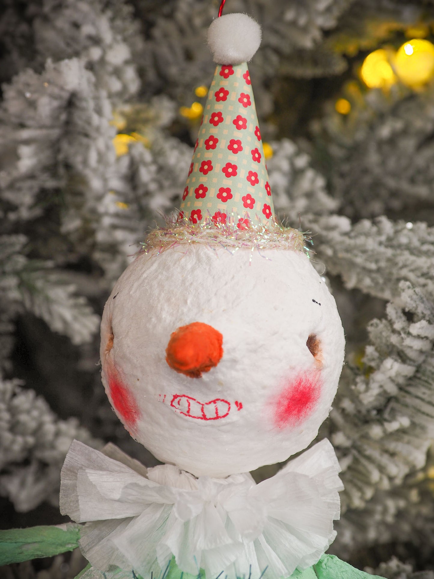 Adorable handmade spun cotton Art Doll Christmas tree ornament by Idania Salcido, the artist by Danita Art. Hand painted by the artist holiday figurine with paper hat with tinsel and vintage style garlands and a tiny Christmas tree. Hang this handmade ornament from your Christmas tree or use as Holiday decoration.