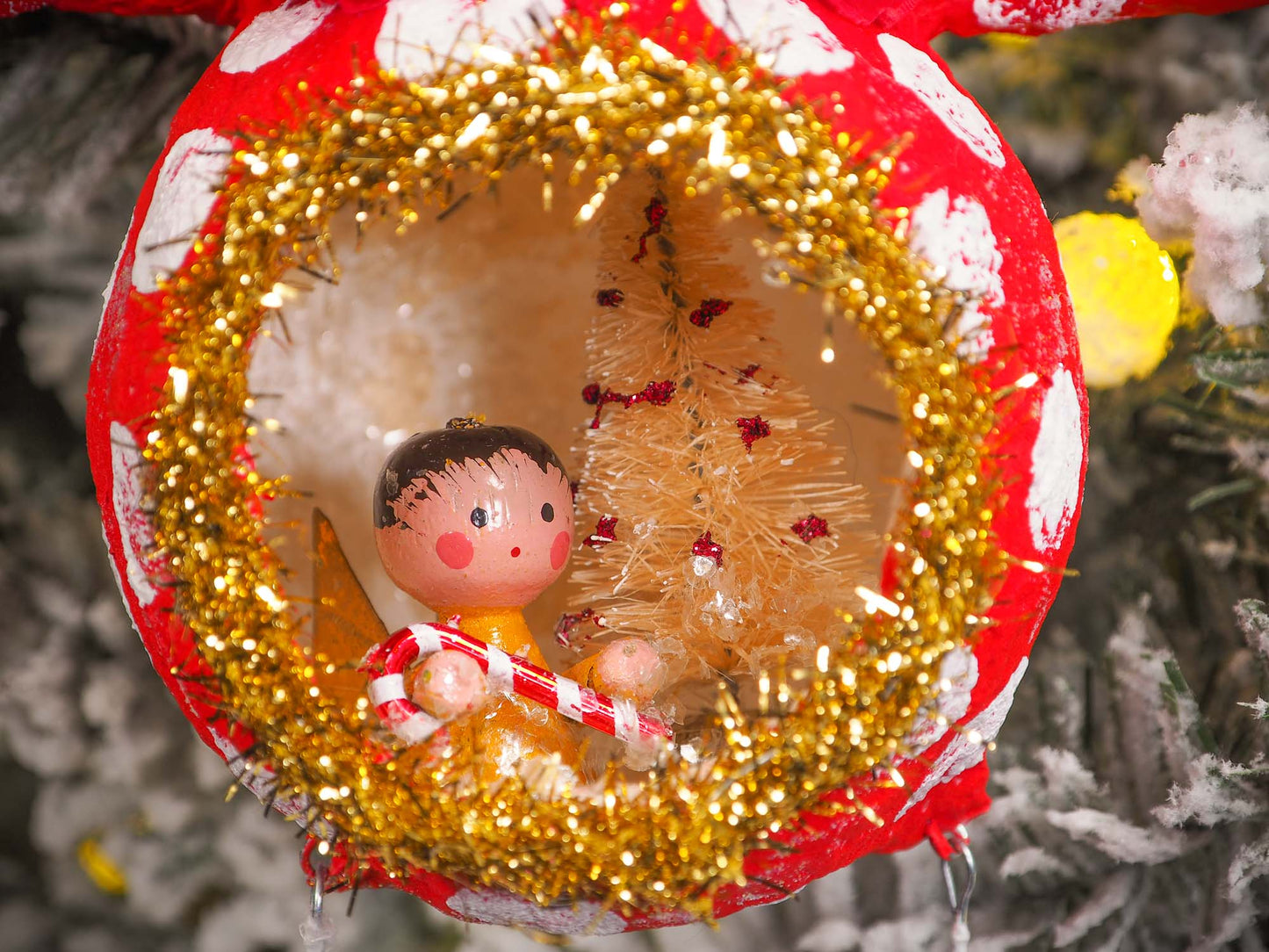 Adorable handmade spun cotton Art Doll Christmas tree ornament by Idania Salcido, the artist by Danita Art. Hand painted by the artist holiday figurine with paper hat with tinsel and vintage style garlands and a tiny Christmas tree. Hang this handmade ornament from your Christmas tree or use as Holiday decoration.