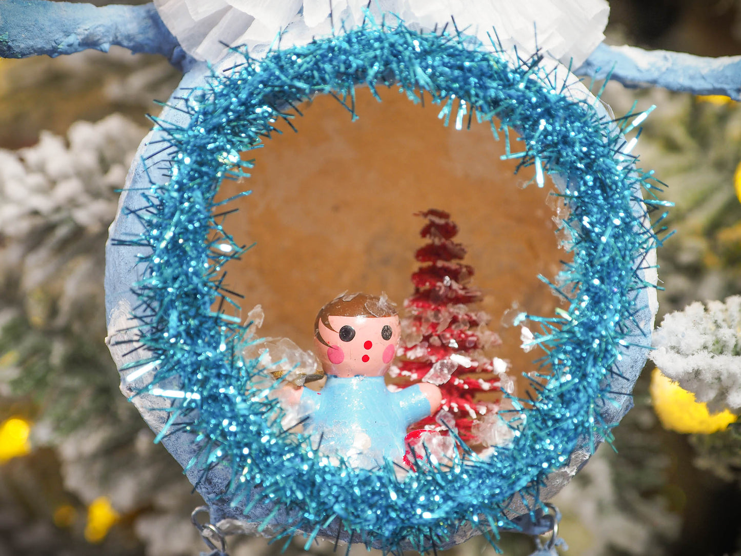 Adorable handmade spun cotton Art Doll Christmas tree ornament by Idania Salcido, the artist by Danita Art. Hand painted by the artist holiday figurine with paper hat with tinsel and vintage style garlands and a tiny Christmas tree. Hang this handmade ornament from your Christmas tree or use as Holiday decoration.