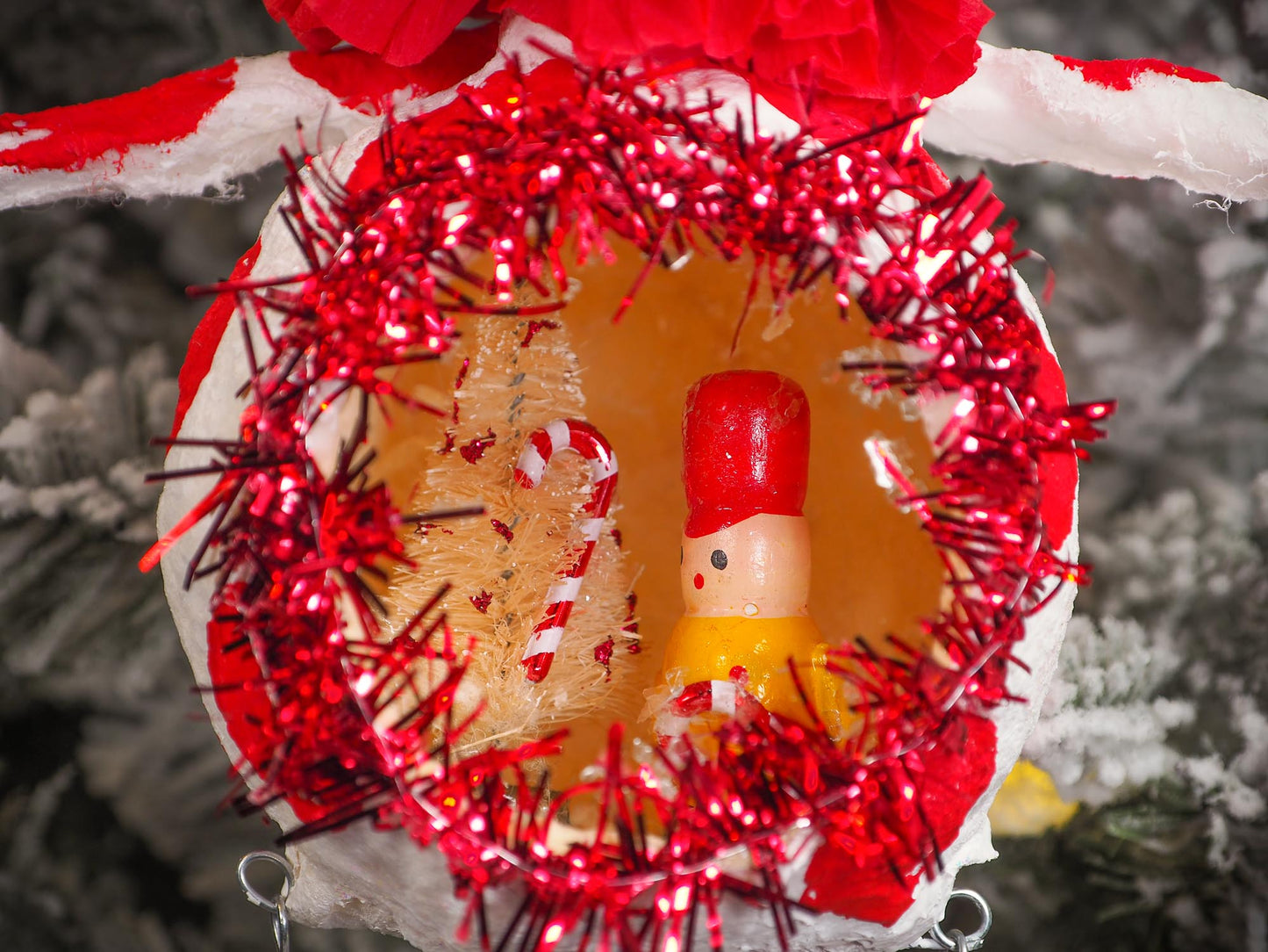 Adorable handmade spun cotton Art Doll Christmas tree ornament by Idania Salcido, the artist by Danita Art. Hand painted by the artist holiday figurine with paper hat with tinsel and vintage style garlands and a tiny Christmas tree. Hang this handmade ornament from your Christmas tree or use as Holiday decoration.