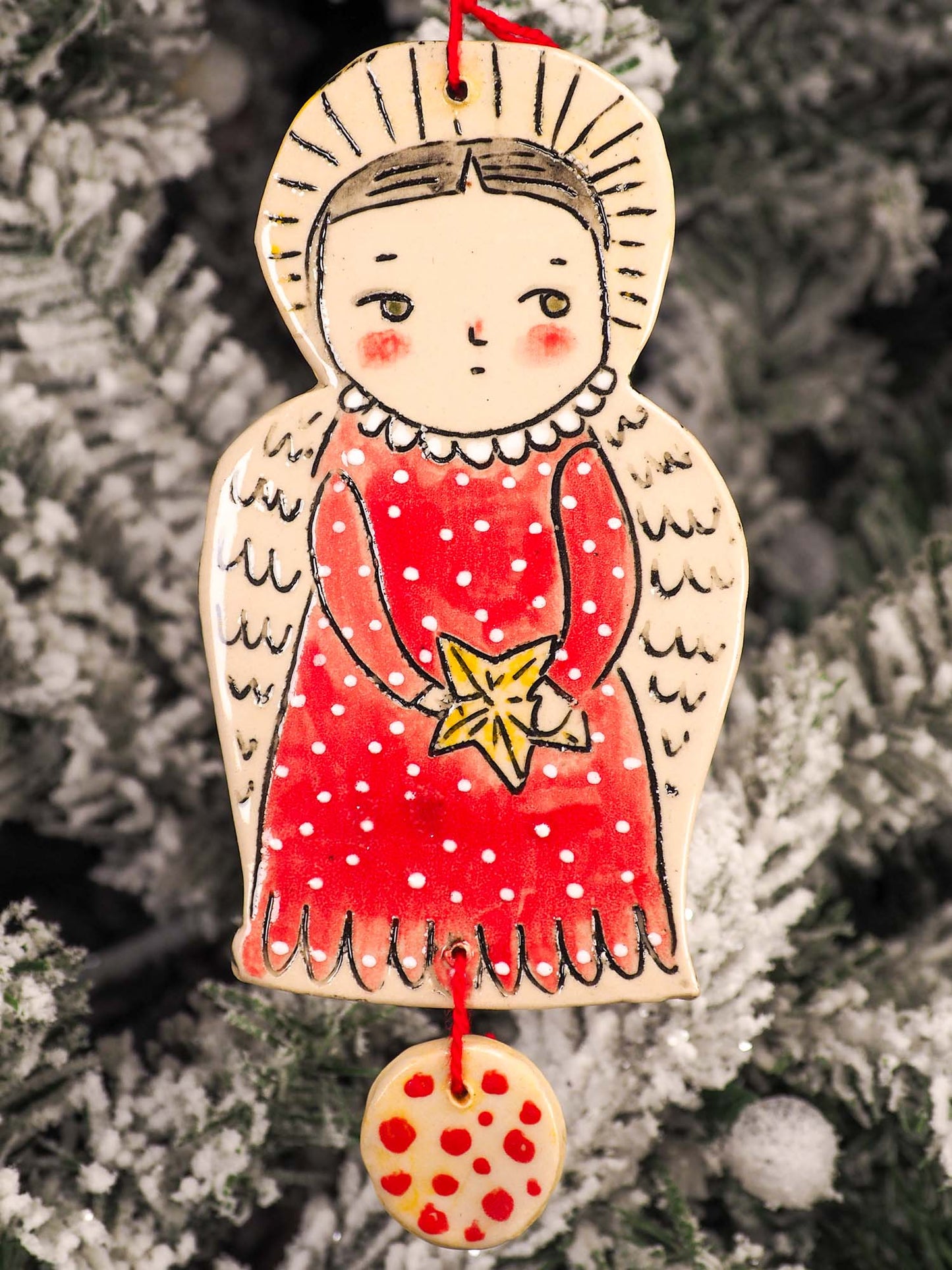 An original Christmas Holiday tree round glazed ceramic ornament handmade by Idania Salcido, the artist behind Danita Art. Glazed carved sgraffito stoneware, hand painted and decorated, it is illustrated by hand with snowmen, Christmas trees, Santa Claus, angels and snow balls and winter themes.