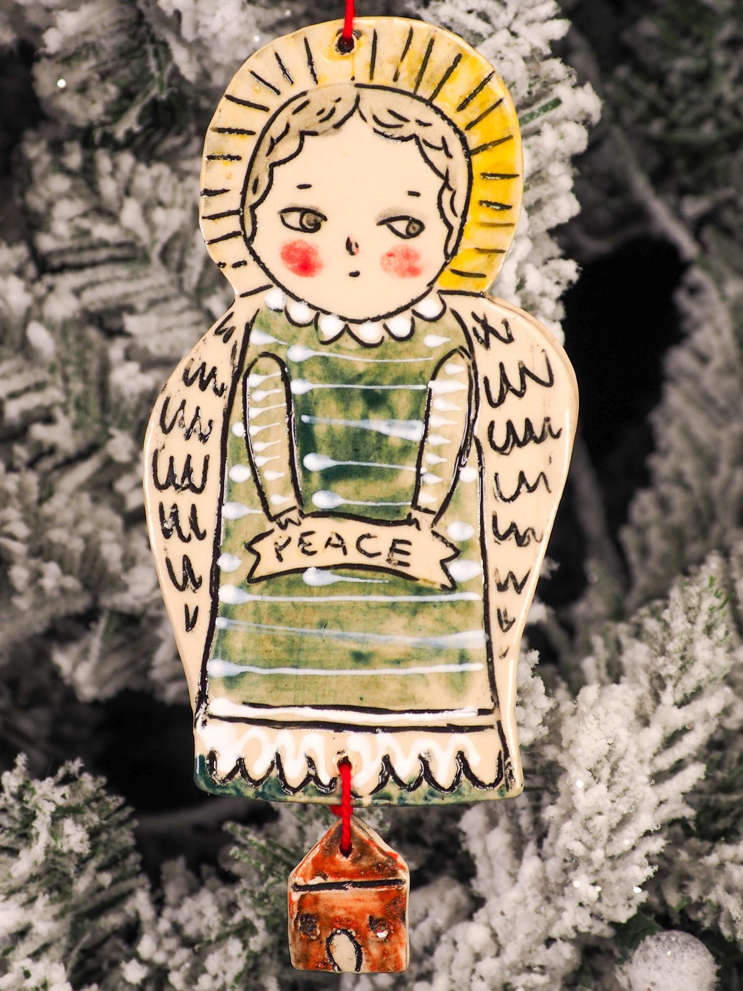 An original Christmas Holiday tree round glazed ceramic ornament handmade by Idania Salcido, the artist behind Danita Art. Glazed carved sgraffito stoneware, hand painted and decorated, it is illustrated by hand with snowmen, Christmas trees, Santa Claus, angels and snow balls and winter themes.