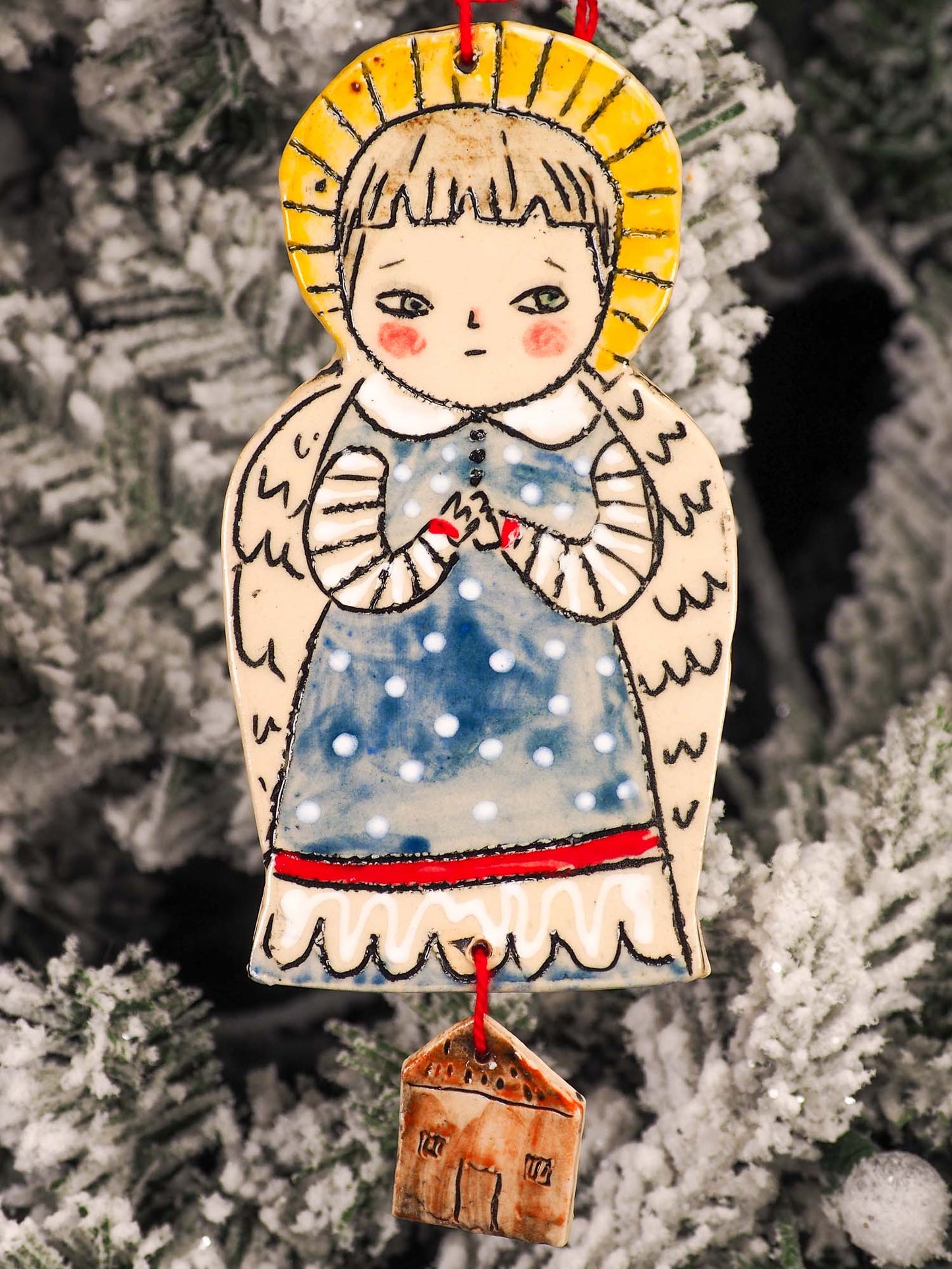 An original Christmas Holiday tree round glazed ceramic ornament handmade by Idania Salcido, the artist behind Danita Art. Glazed carved sgraffito stoneware, hand painted and decorated, it is illustrated by hand with snowmen, Christmas trees, Santa Claus, angels and snow balls and winter themes.