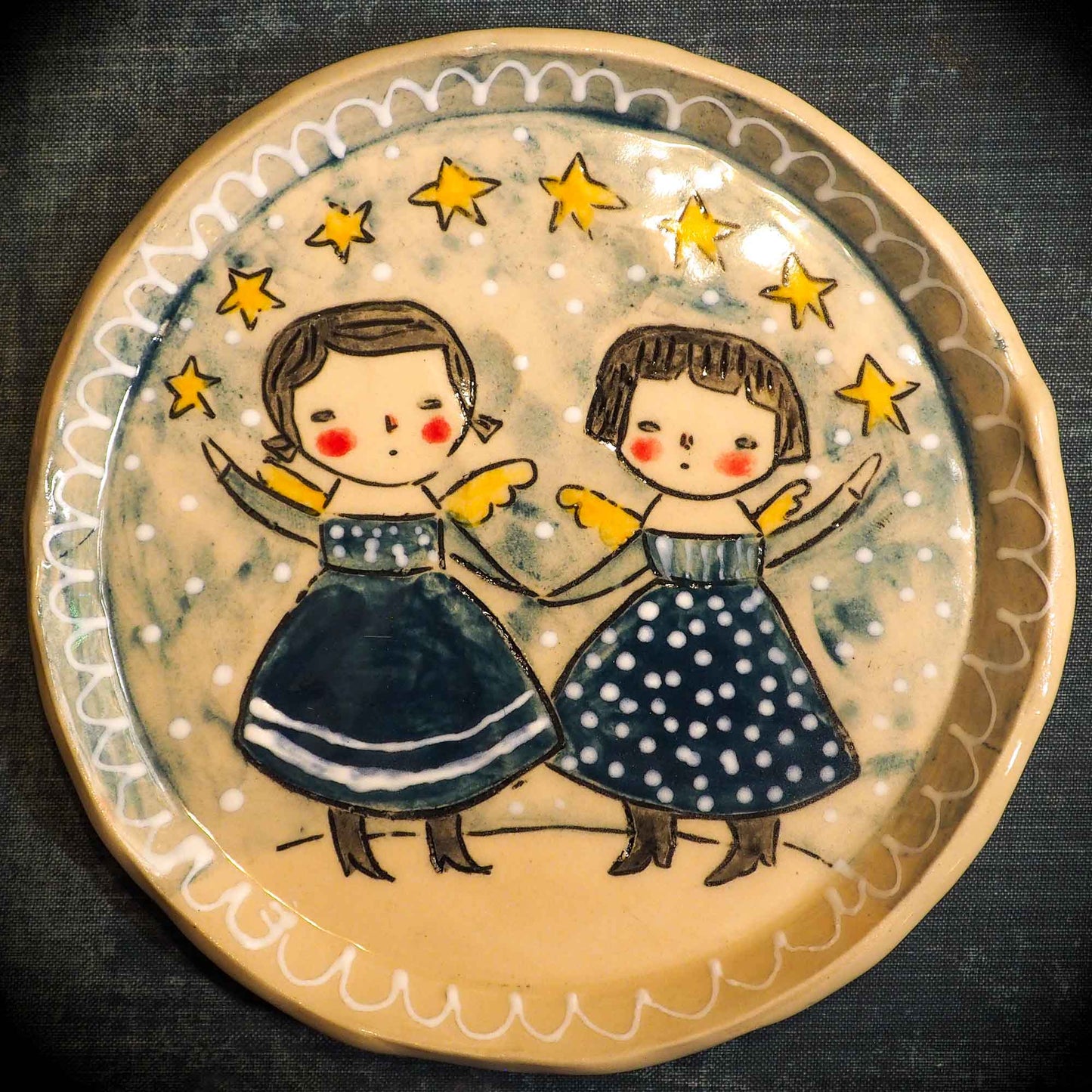 An original Christmas Holiday cake dinner dessert plate round glazed ceramic dinnerware handmade by Idania Salcido, the artist behind Danita Art. Glazed carved sgraffito stoneware, hand painted and decorated, it is illustrated by hand with snowmen, Christmas trees, Santa Claus, angels and snowballs and winter themes.
