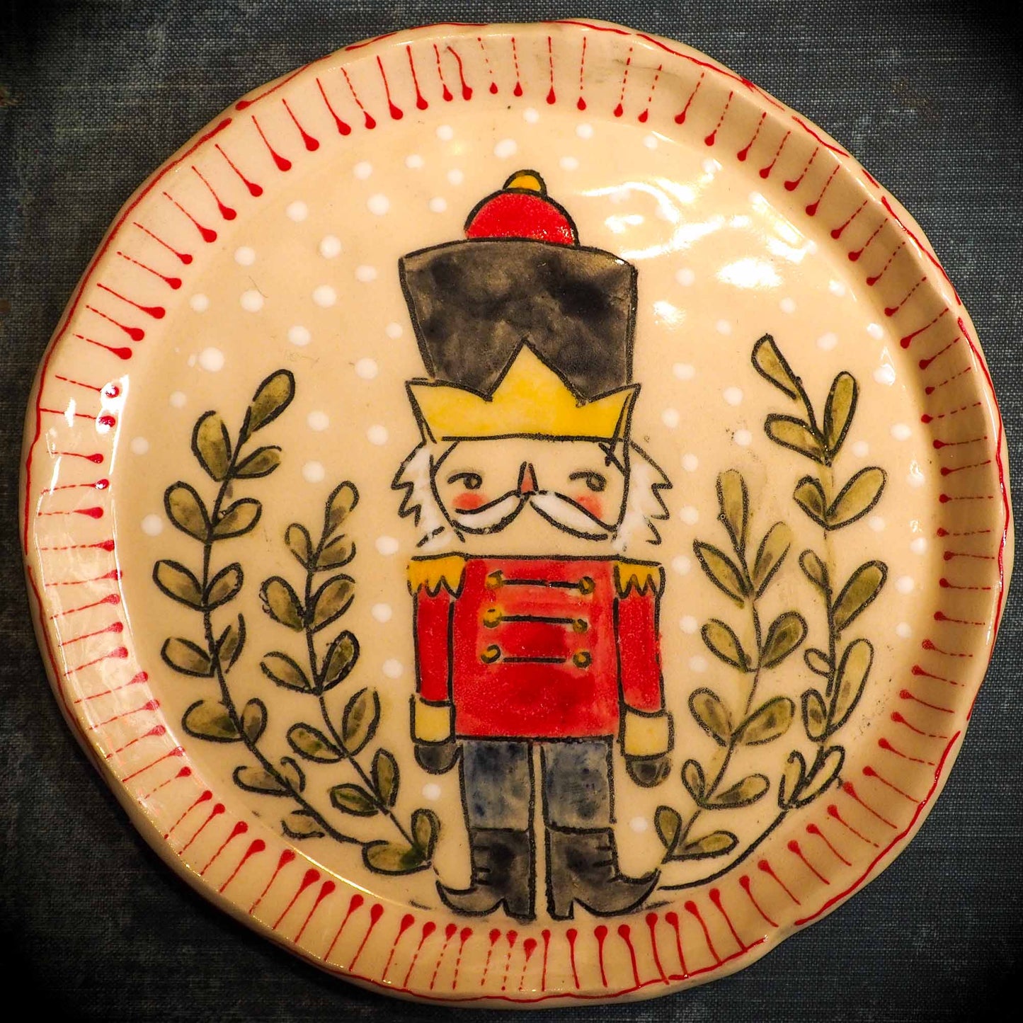 An original Christmas Holiday cake dinner dessert plate round glazed ceramic dinnerware handmade by Idania Salcido, the artist behind Danita Art. Glazed carved sgraffito stoneware, hand painted and decorated, it is illustrated by hand with snowmen, Christmas trees, Santa Claus, angels and snowballs and winter themes.