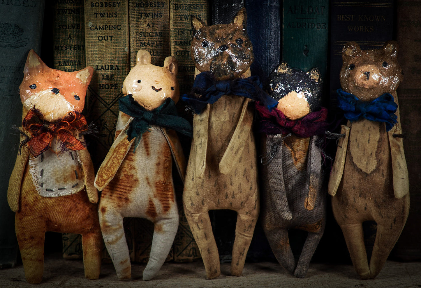 Soft sculpture art doll by Idania Salcido Danita Art with a Handmade ceramics face, organic dyed fabric and silk bow