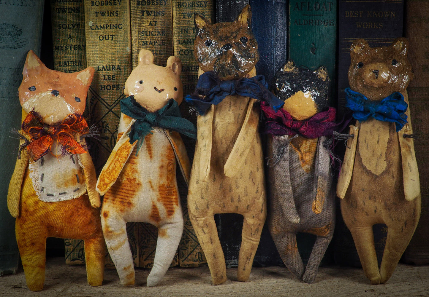 Soft sculpture art doll by Idania Salcido Danita Art with a Handmade ceramics face, organic dyed fabric and silk bow