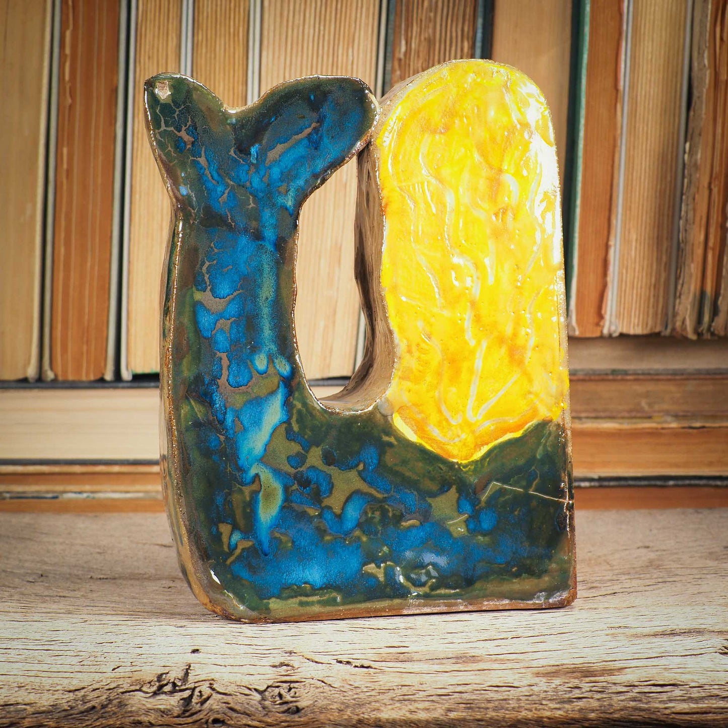 This little mermaid is a little shy, but she is beautiful and perfect to live on a shelf where she can command her realm An original sculpture by Idania Salcido