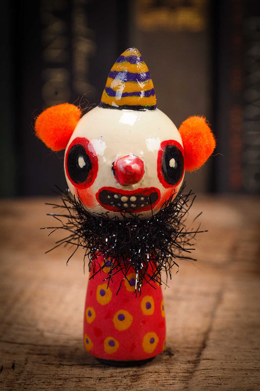 Small Halloween mini kokeshi art doll evil it pennywise clown figurine with painted makeup, orange polka dot body and party hat. Made by Idania Salcido, Danita Art.