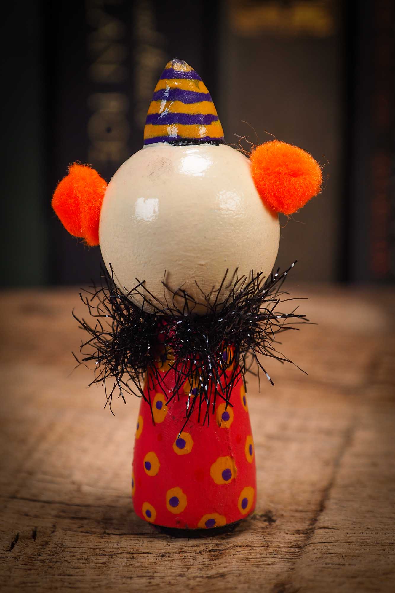Small Halloween mini kokeshi art doll evil it pennywise clown figurine with painted makeup, orange polka dot body and party hat. Made by Idania Salcido, Danita Art.