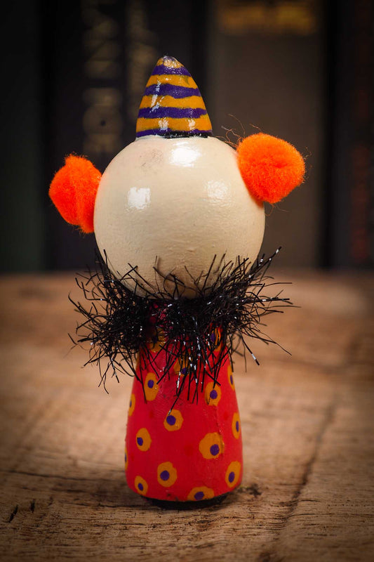 Small Halloween mini kokeshi art doll evil it pennywise clown figurine with painted makeup, orange polka dot body and party hat. Made by Idania Salcido, Danita Art.