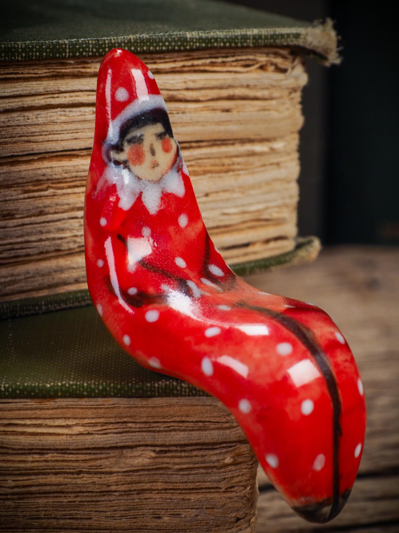 Handmade ceramic red shelf elf companion by Idania Salcido aka Danita Art.