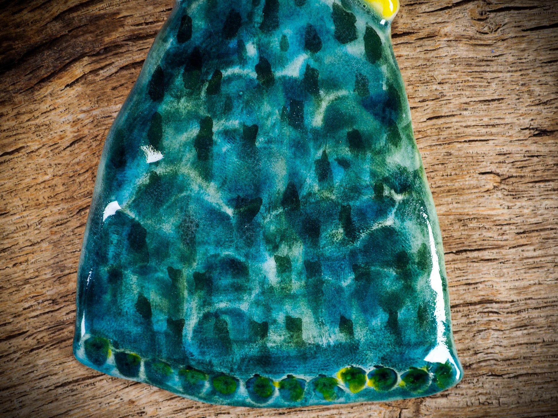 Handmade ceramic star figure ornament with painted face and blue-green gown, created by Idania Salcido Danita Art for Christmas decorating or gifting.