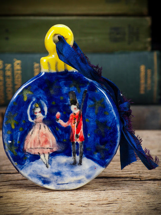 Handmade ceramic Nutcracker and ballerina ornament painted in blue and red by Idania Salcido aka Danita Art.