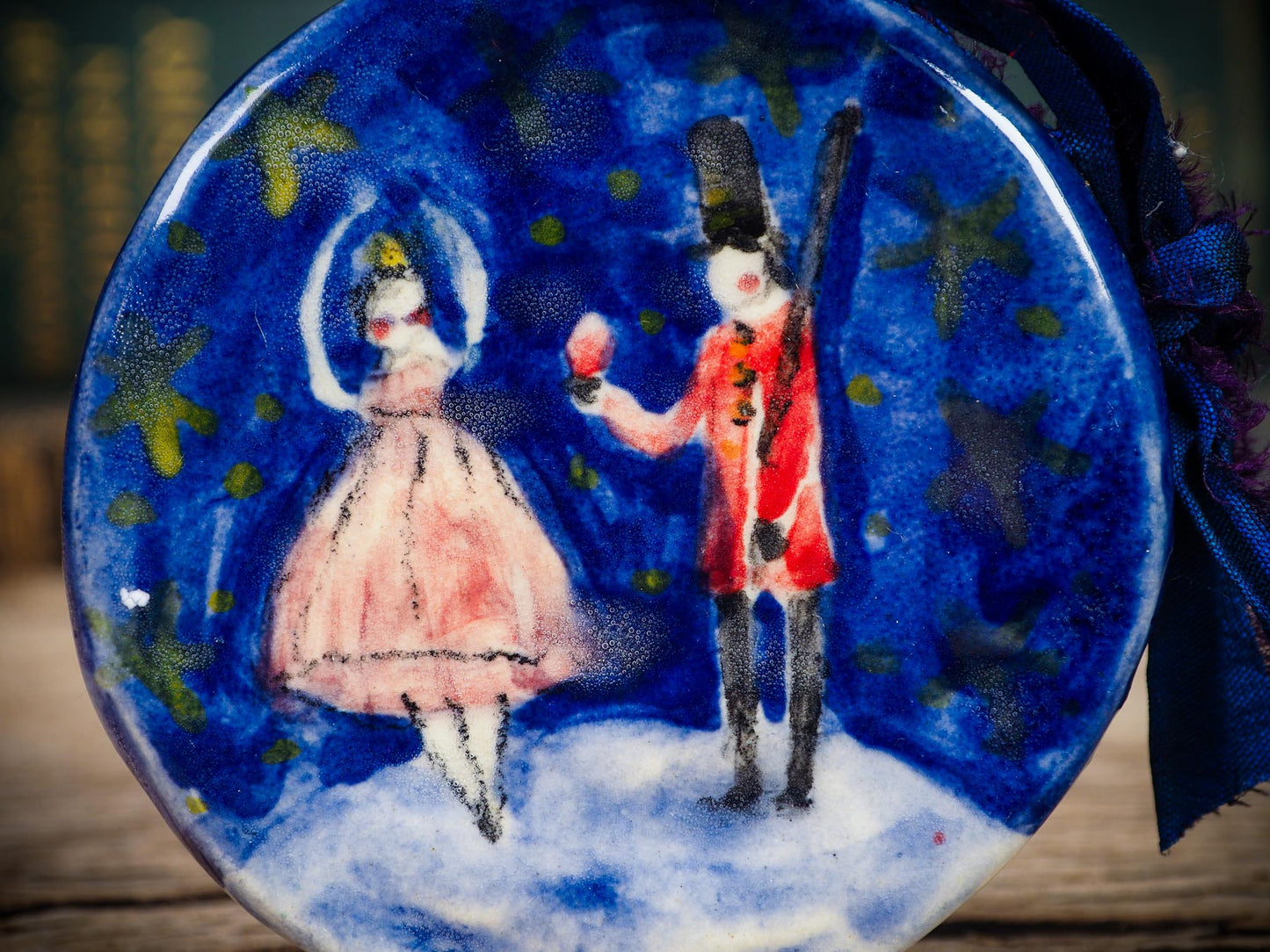 Handmade ceramic Nutcracker and ballerina ornament painted in blue and red by Idania Salcido aka Danita Art.