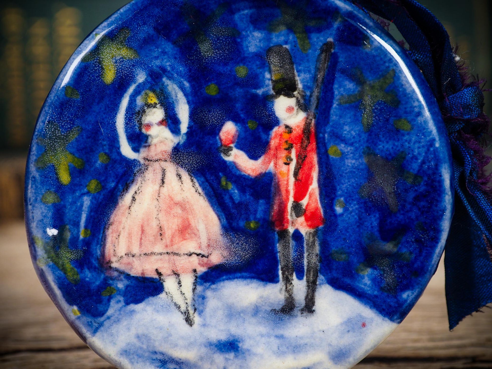 Handmade ceramic Nutcracker and ballerina ornament painted in blue and red by Idania Salcido aka Danita Art.