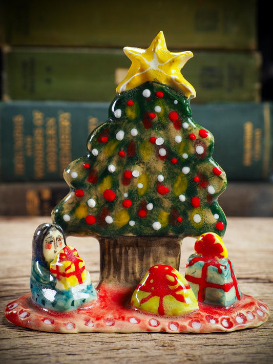 Handmade ceramic Christmas tree scene with child and gifts by Idania Salcido aka Danita Art.